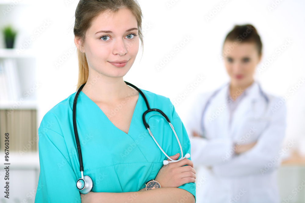 Portrait of young female surgeon doctor in a hospital Portrait of young female surgeon doctor in a hospital