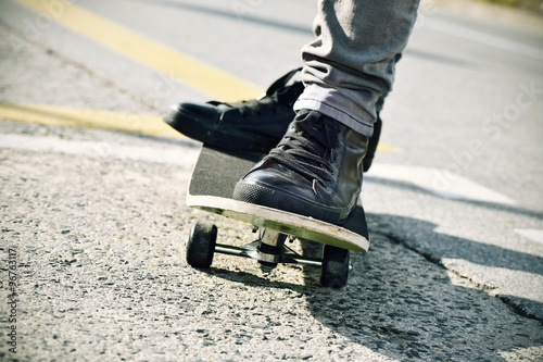 young man skateboarding, filtered