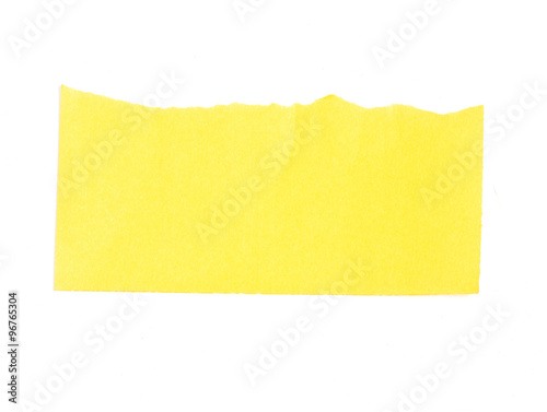Torn yellow paper banner isolated on white.