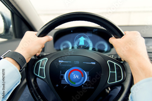 close up of man driving car with volume level icon