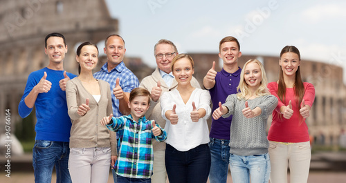 Canvas Print happy people showing thumbs up over coliseum