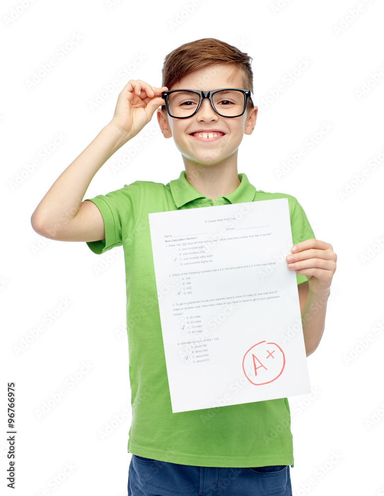 happy boy in eyeglasses holding school test result happy boy in eyeglasses holding school test result