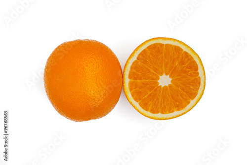 One and half oranges on white background