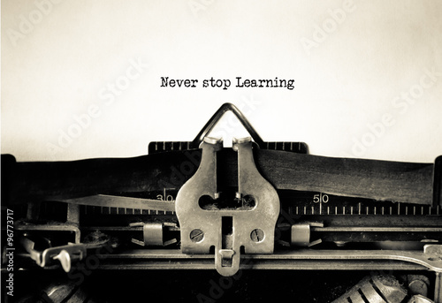 Never Stop Learning word typed on a Vintage Typewriter.
