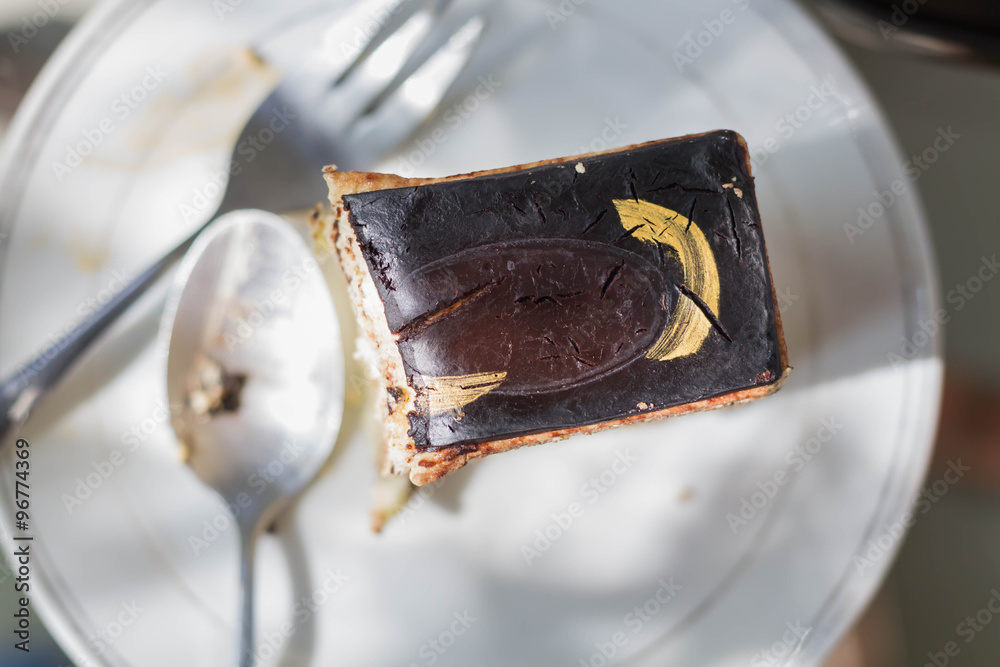 Fototapeta premium Delicious chocolate cake on plate that is eaten