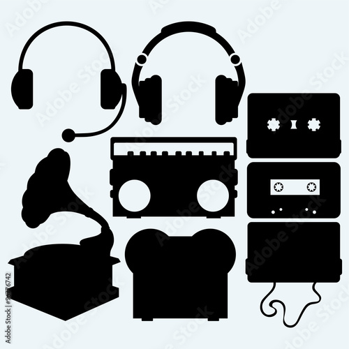 Set musical instrument. Recorder, audio cassette tape, headphones and old record player. Isolated on blue background. Vector silhouettes