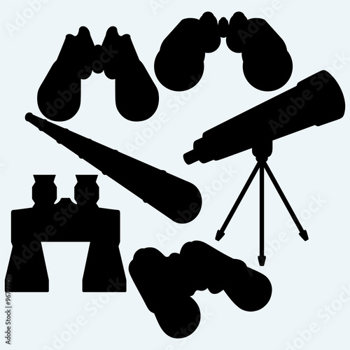 Binoculars, spyglass and telescope in tripod . Isolated on blue background. Vector silhouettes