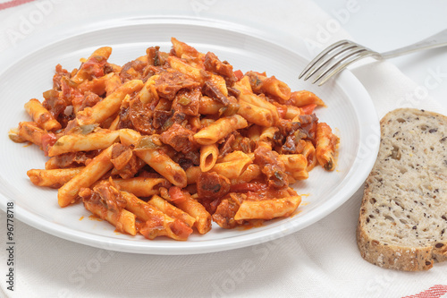Macaroni with tomato sauce, sausage and pepper.