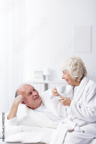 Elderly married couple in bed