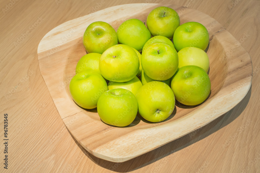 Green apples in wooden tray Green apples in wooden tray