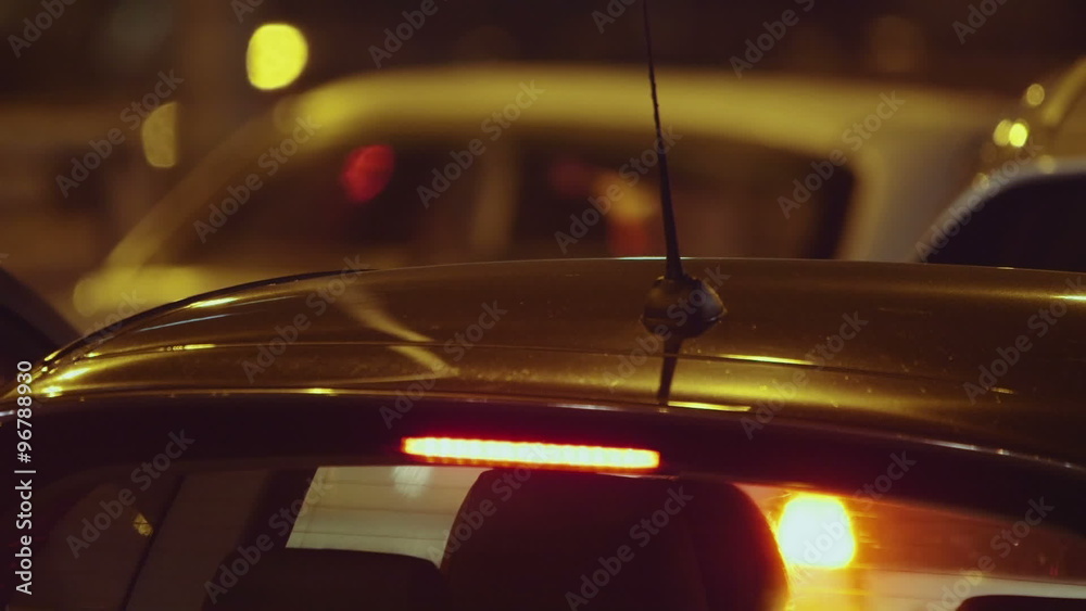 Night traffic jam at city telephoto lens cars grind to a halt on avenue