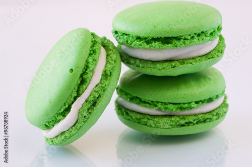 green French Macarons on a white background