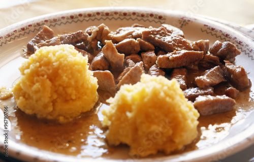 Tochitura Romanian dish made from beef and pork served polenta. photo