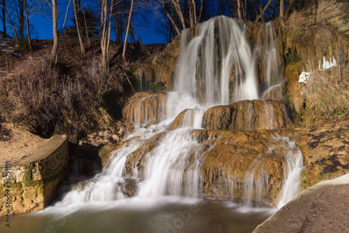 Cascading waterfallt against the night sky