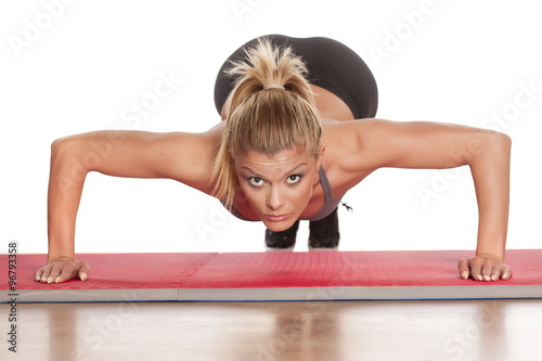 pretty athletic blonde doing push-ups