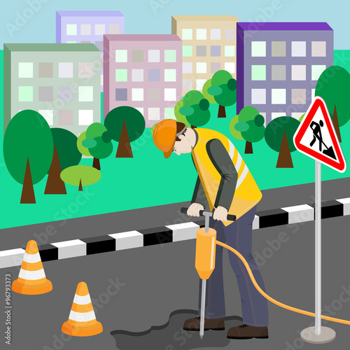 Repairing of the road. Repairman with jackhammer