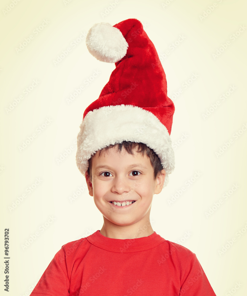 winter holiday christmas concept - boy in santa hat portrait on white isolated winter holiday christmas concept - boy in santa hat portrait on white isolated
