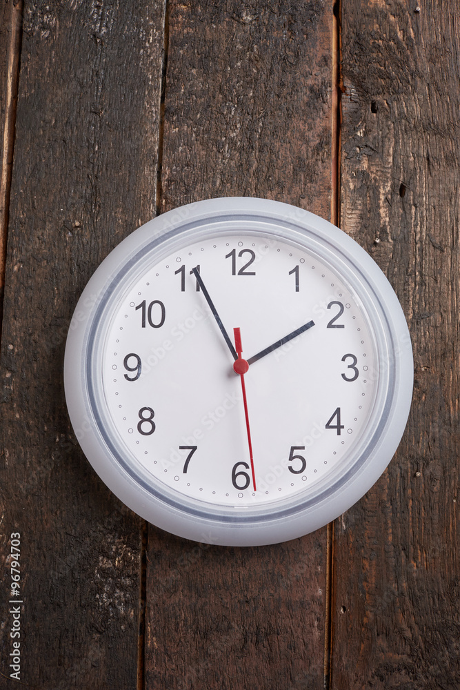 clock on a wooden wall clock on a wooden wall