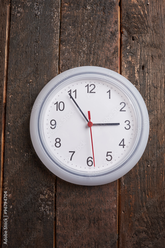 clock on a wooden wall clock on a wooden wall