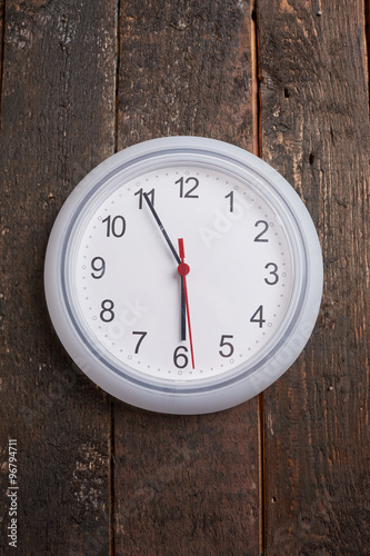 clock on a wooden wall