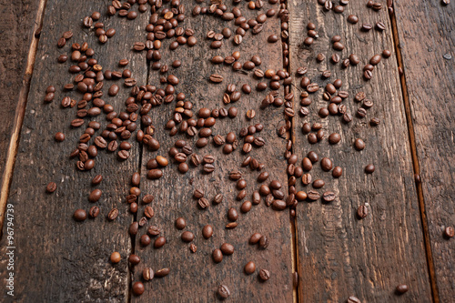 coffee beans scattered on the wooden table