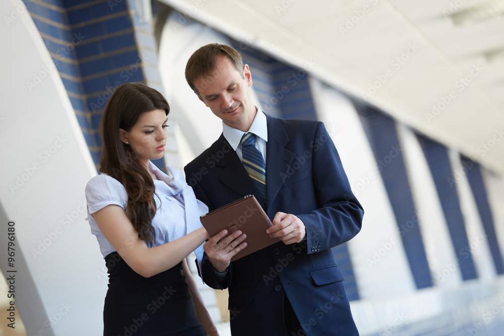 business woman and a businessman with a tablet business woman and a businessman with a tablet