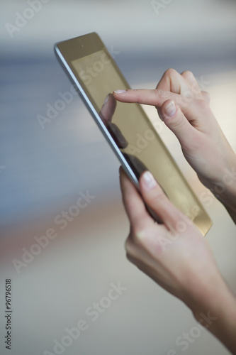 tablet in female hands closeup