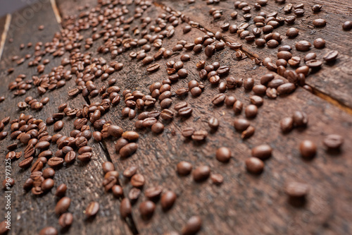 coffee beans scattered on the wooden table