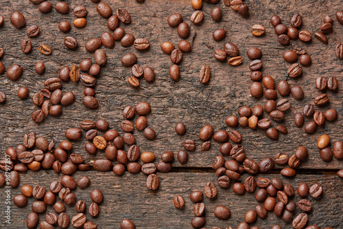 coffee beans scattered on the wooden table