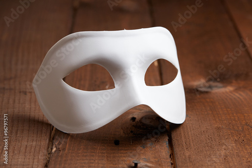 White Venetian mask on the table