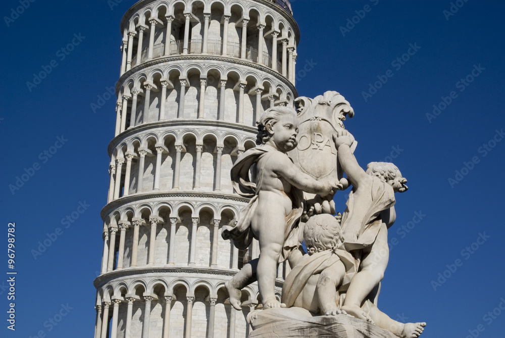Leaning Tower of Pisa with a statue in foreground