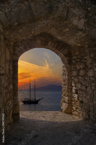 Traditional boat at sunset in Santorini island, Greece photo