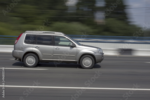 Grey family car quickly goes on the road © sa4e4ek