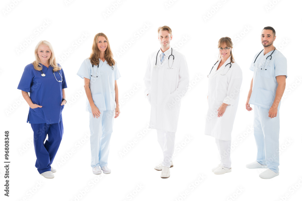 Portrait Of Confident Medical Team Standing In Row Portrait Of Confident Medical Team Standing In Row