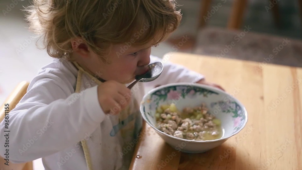 The little girl independently eats soup Ukraine The little girl independently eats soup Ukraine