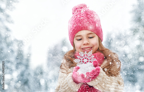 girl playing on a winter walk