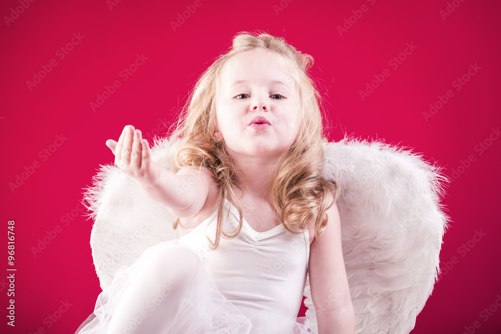 Beautiful blond hair angel on a red background Beautiful blond hair angel on a red background