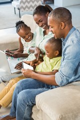 Happy family using technology together