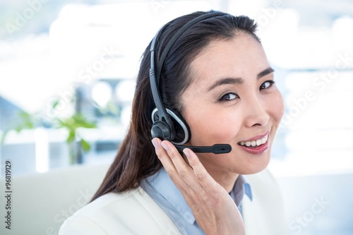 Smiling businesswoman with headset 