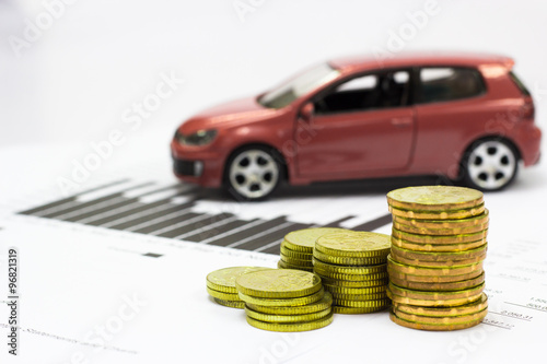 Car model and Financial statement with coins. (finance and car loan concept)