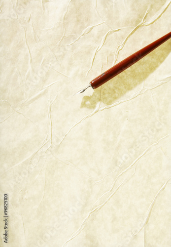 Yellow sheet of paper folded isolated over black. Path included.