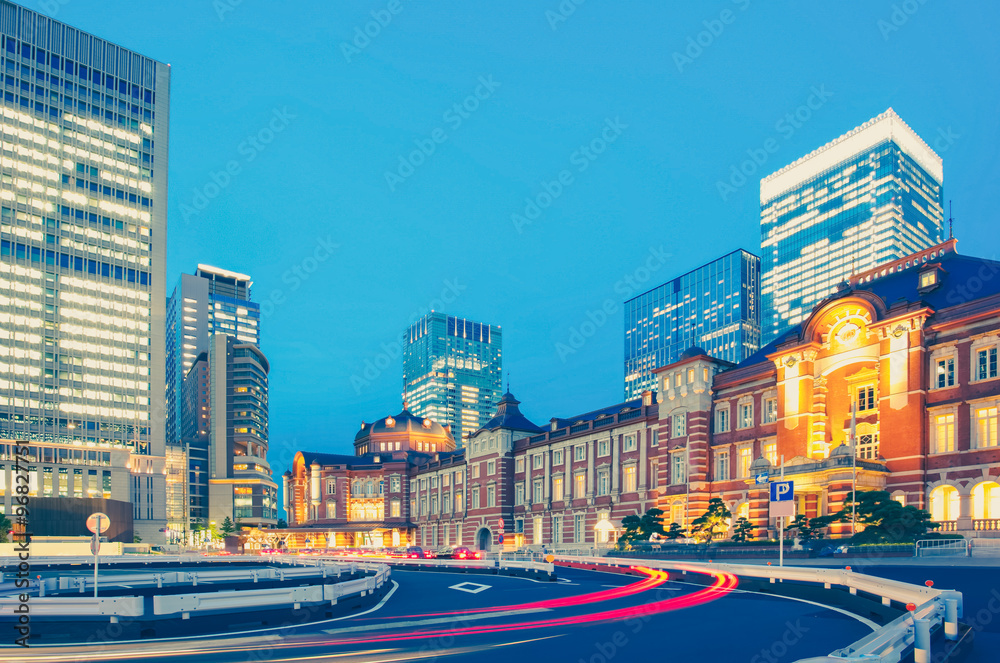 Tokyo railway station and Tokyo highrise building at twilight time..