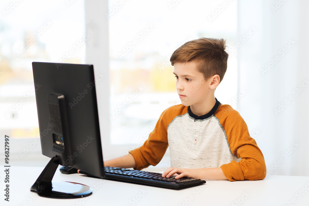 boy with computer at home