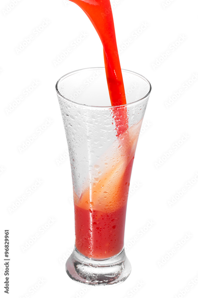 pouring tomato juice in a glass, isolated on white pouring tomato juice in a glass, isolated on white