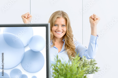 Businesswoman celebrating s...