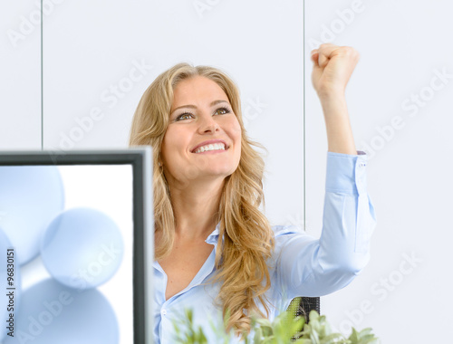 Businesswoman celebrating s...