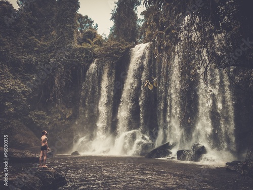 A man at the waterfall, Phnom Koulen at Siem Reap, Cambodia photo