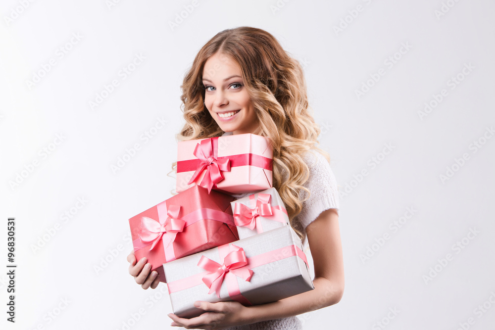 Beautiful smiling woman holding a gift. Beautiful smiling woman holding a gift.