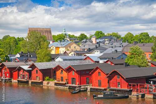 Old red wooden houses on river coast. Porvoo
