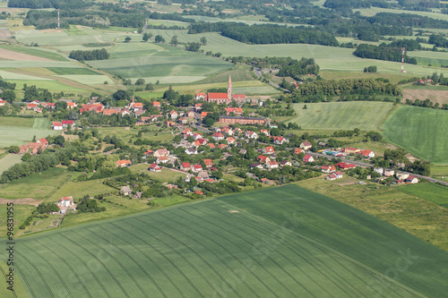 aerial view of the village and green harvest fields